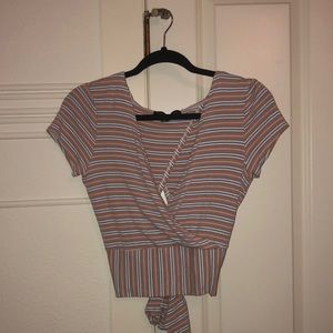 Stripped shirt from Nordstrom that urs in the back. Size Medium.